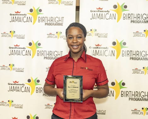 Student holding certificate